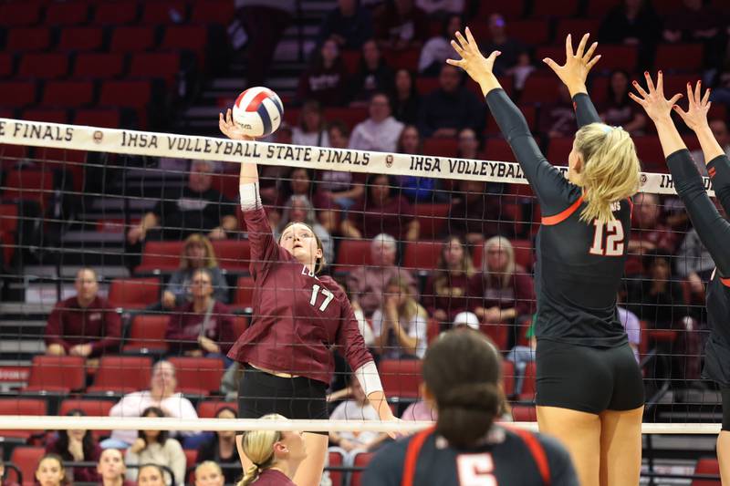 Lockport's Bridget Ferriter sends the ball over a Benet Academy block during Benet Academy's victory in two sets, 25-23, 25-16, over Lockport in the IHSA Class 4A State semifinals on Friday, Nov. 14, 2025.