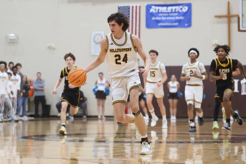 Joliet Catholic’s Elias Passehl breaks away upcourt against Elmwood Park in the Class 3A Joliet Catholic Regional semifinal game on Wednesday, Feb. 25, 2026 in Joliet.