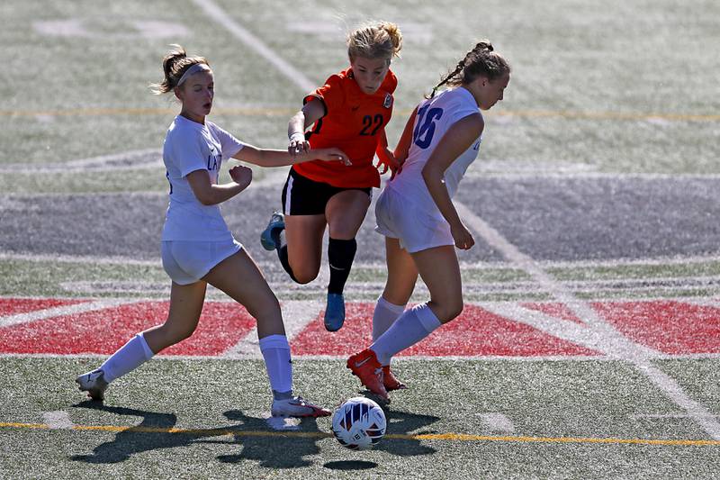 Crystal Lake Central's Olivia Anderson tries to split the Lake Forest defense to get to the ball during a Class 2A Deerfield Sectional semi-final match on Tuesday, May 21, 2024, at Deerfield High School.