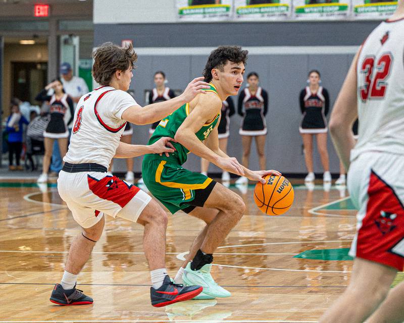 Bradyen Simek (22) of Seneca dribbles ball as Greyson Bickett (0) of Hall guards him at hip during game in the Shipyard Showdown on Tuesday, December 23, 2025 at Seneca High School in Seneca.