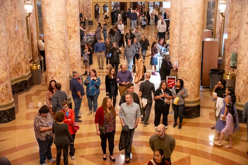 Concert attendees for the Vitamin String Quartet enter the lobby for the reopening of the Rialto Square Theatre in Joliet, Ill. on Tuesday Oct. 22, 2024