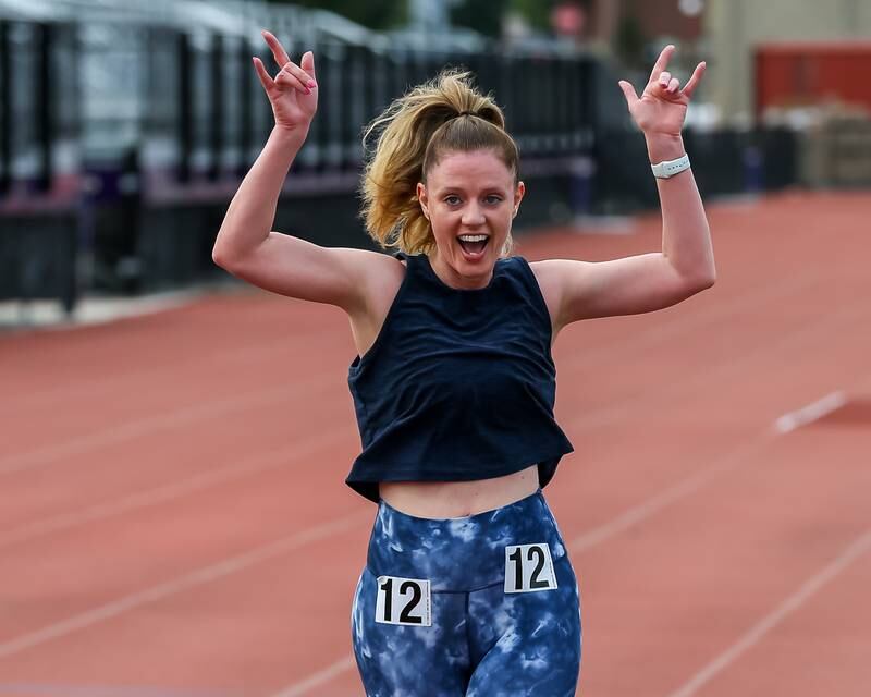 Melissa Mertes finishes her mile run at the community festival and running fundraiser for mental health awareness and suicide prevention in honor of Ben Silver.  July 23, 2022.