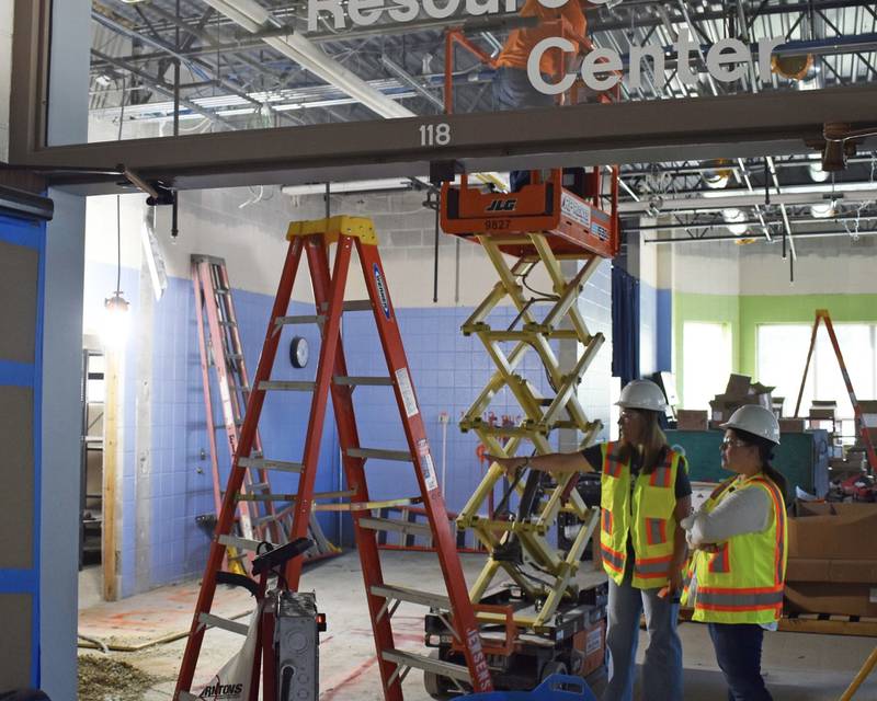 St. Charles School District 303 Director of Student Services Aubree Shuett (left) and Transition Program Department Chair Anne Dragosh (right) observe construction work at at Lincoln School.