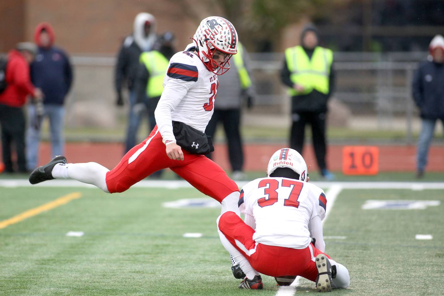 St. Rita's Conor Talty (31) kicks an extra point during their 7A quarterfinal game against St. Charles North in St. Charles on Saturday, Nov. 12, 2022.