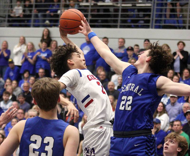 Burlington Central’s Nick Gouriotis, right, and Marmion Academy’s Jabe Haith battle in IHSA Class 3A Sectional title game action at Burlington Central High School Friday night.
