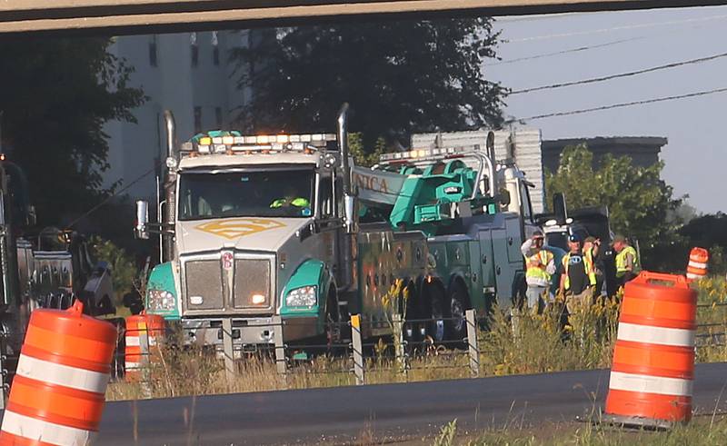 Emergency crews work the scene of a semi truck that struck the overpass of Illinois Route 251 and Interstate I-80 on Friday, Sept. 26, 2025 in Peru. The driver of the semi had to be extricated. Illinois State Police, Peru Fire and EMS,  Senica Towing and Illinois Department of Transportation were all on the scene.