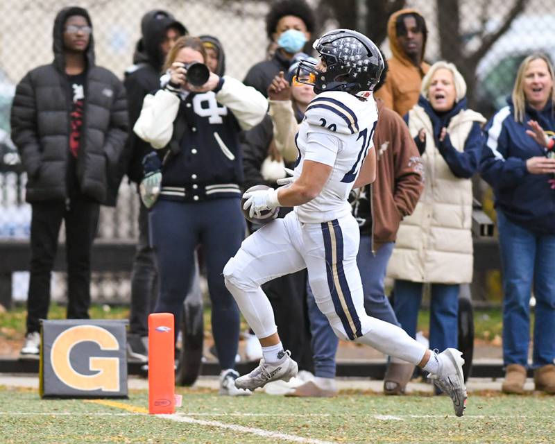IC Catholic Prep's KC Kekstadt (20) runs into the endzone for a touchdown during the 3A Playoff game against Chicago Hope Academy on Saturday Nov. 1, 2025, held at Altgeld Park in Chicago.