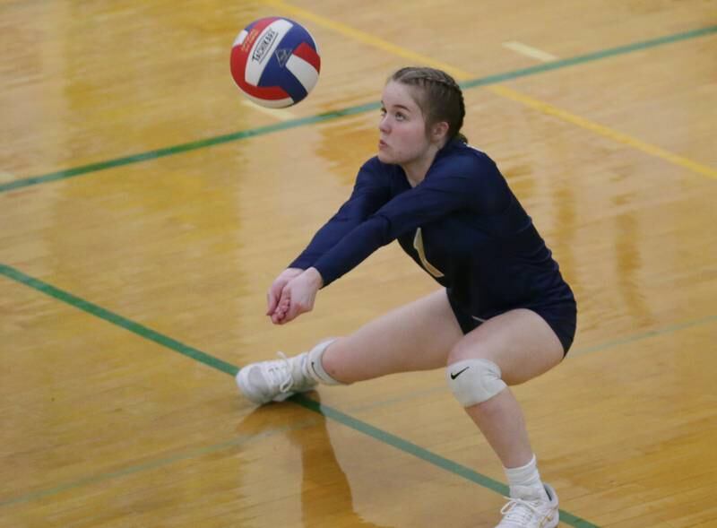 Marquette's Emma Rinearson digs the ball against Dwight in the Tri-County Conference volleyball Tournament on Monday, Oct. 10, 2022 in Dwight