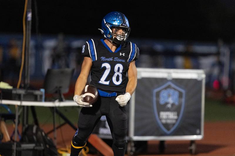 St. Charles North's Carsen Durante celebrates a touchdown against Batavia on Friday, Sept. 26, 2025 in St. Charles.