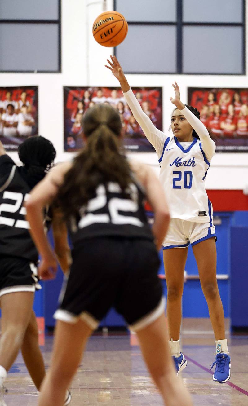 St. Charles North's Sydney Johnson (20) puts up a three during the Dundee-Crown High School 41st Annual Komaromy Classic Friday, Dec. 27, 2024 in Carpentersville.