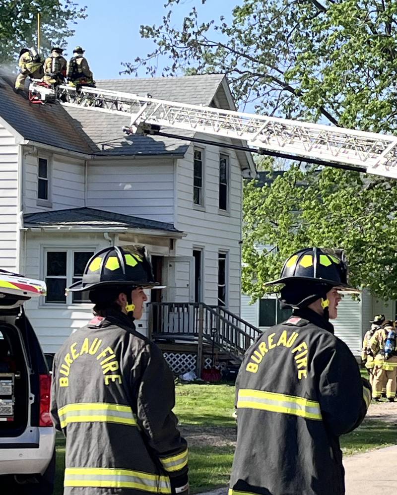 Firefighters work the scene of a house fire in the 800 block of North Mercer Street on Wednesday, April 22, 2026 in Princeton.