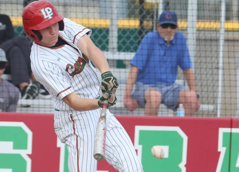 L-P's Braylin Bond makes contact with the ball while playing Morris on Friday, April 17, 2026 at Huby Sarver Field in the L-P Athletic Complex in La Salle.