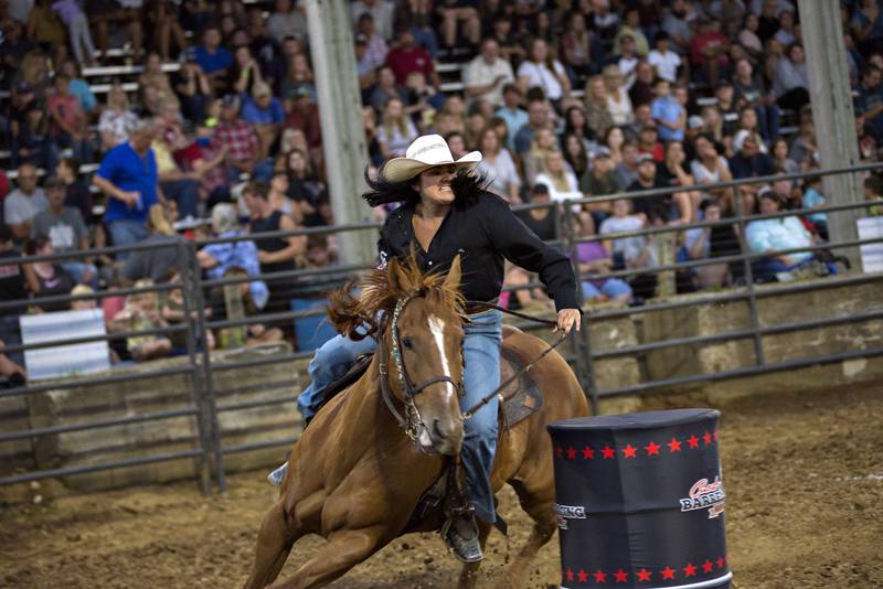 Barrel racer Abby Klein turns the last barrel on her run Thursday night in Milledgeville.