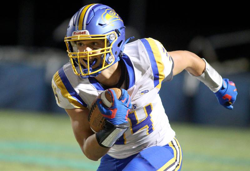 Johnsburg’s Duke Mays runs the ball in varsity football on Friday Sept. 27, 2024, at Woodstock North High School in Woodstock.