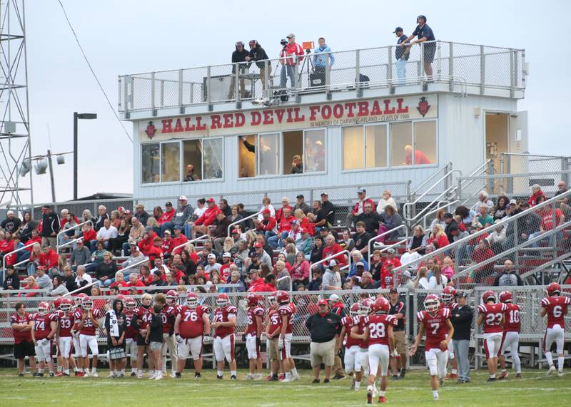 Hall players and coaches get ready to play Bureau Valley on Friday, Sept 8, 2023 at Richard Nesti Stadium.