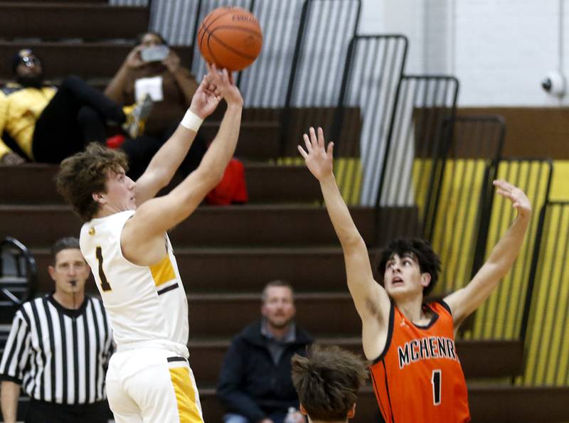 Jacobs' Ben Jurzak shoots the ball over McHenry's Marko Visnjevac during a Fox Valley Conference boys basketball game on Wednesday, Nov. 29, 2023, at Jacobs High School in Algonquin.