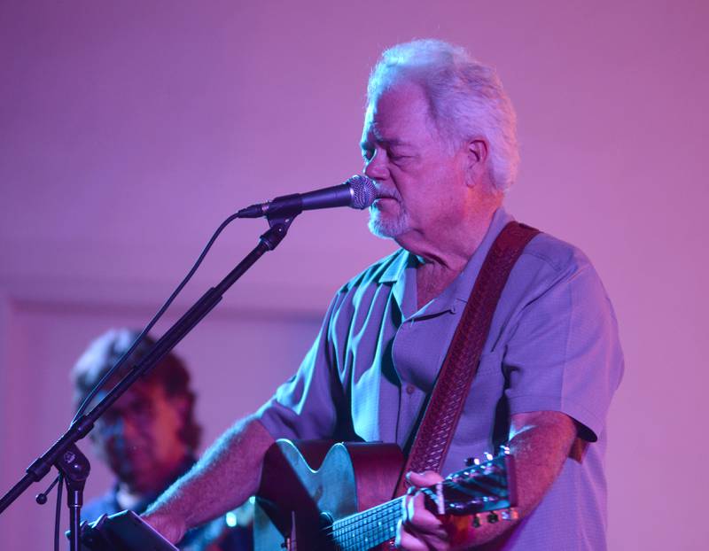 One of the members of Heartache Tonight, an Eagles tribute band, sings a song at the Jamboree Concert Series in Mt. Morris on Friday, Aug. 22, 2025.