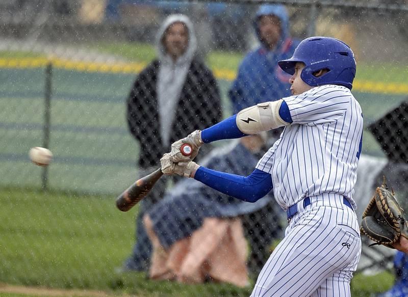 Newman’s Jameson Hanlon drives the ball to right against Mendota Thursday, April 30, 2026.