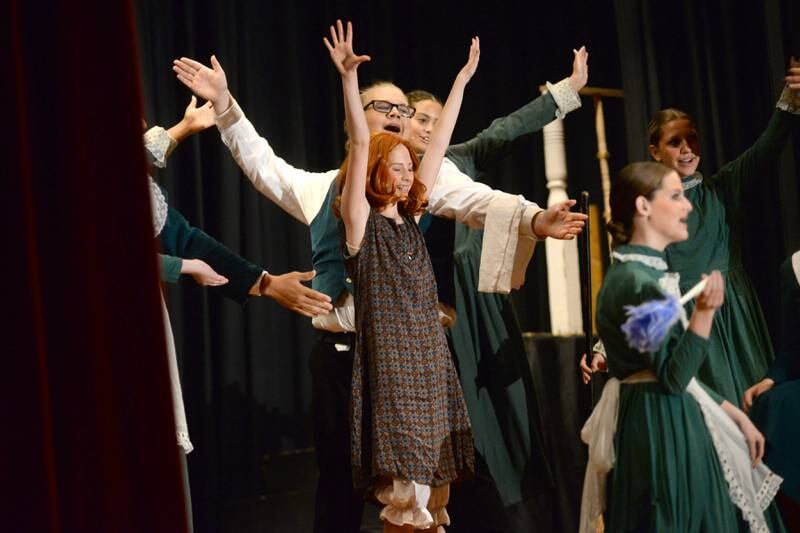 Orphan Annie (Lucy Schneiderman) and other cast members strike a pose during a musical number at Forreston High School's performance of Annie on Sunday, April 28, 2024.