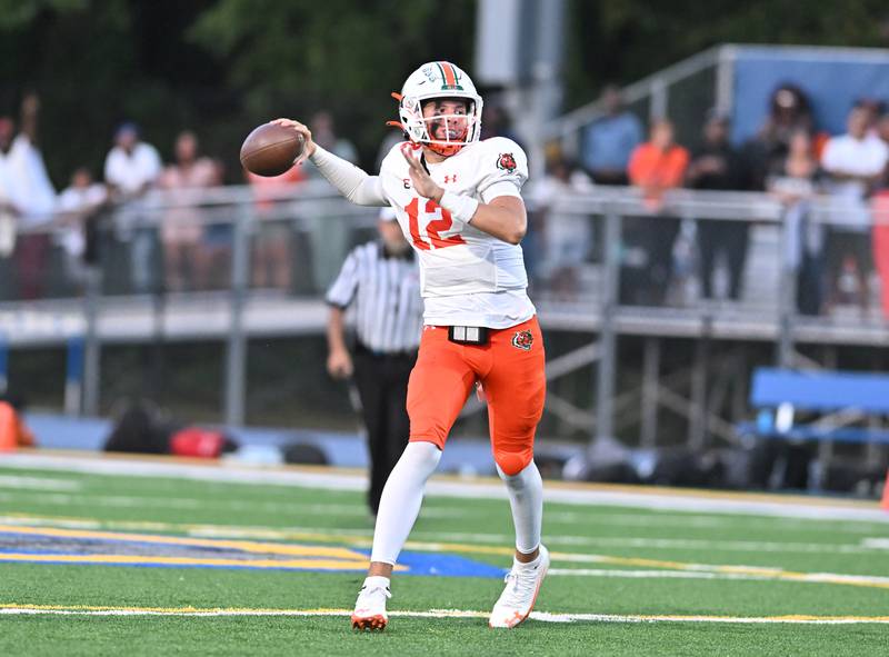 Joliet Central's Jeffrey Woods (7) looks to throw a pass during the conference game against Plainfield East on Friday, SEP. 12, 2025, at Joliet.