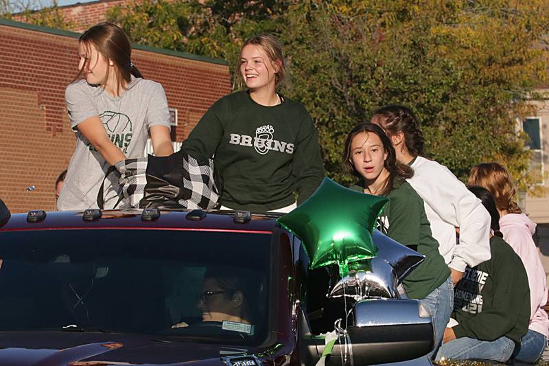St. Bede volleyball players ride in the Homecoming parade on Friday, Sept. 30, 2022 downtown Peru.
