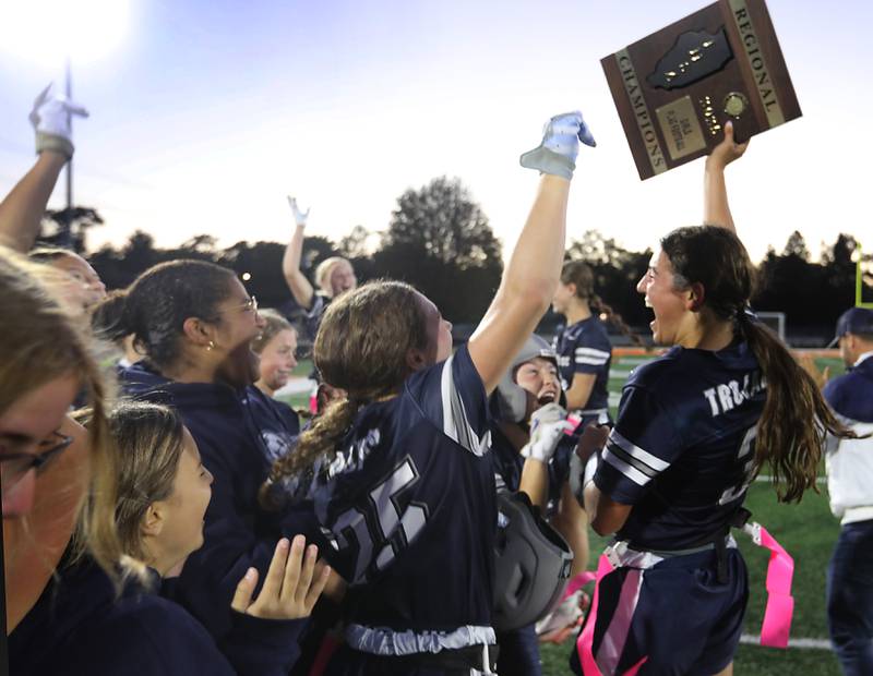 Cary-Grove's Kennedy Manning (right) celebrates their win over McHenry in the IHSA McHenry Regional girls flag football championship game on Wednesday, Oct. 8, 2025, at McCracken Field in McHenry.