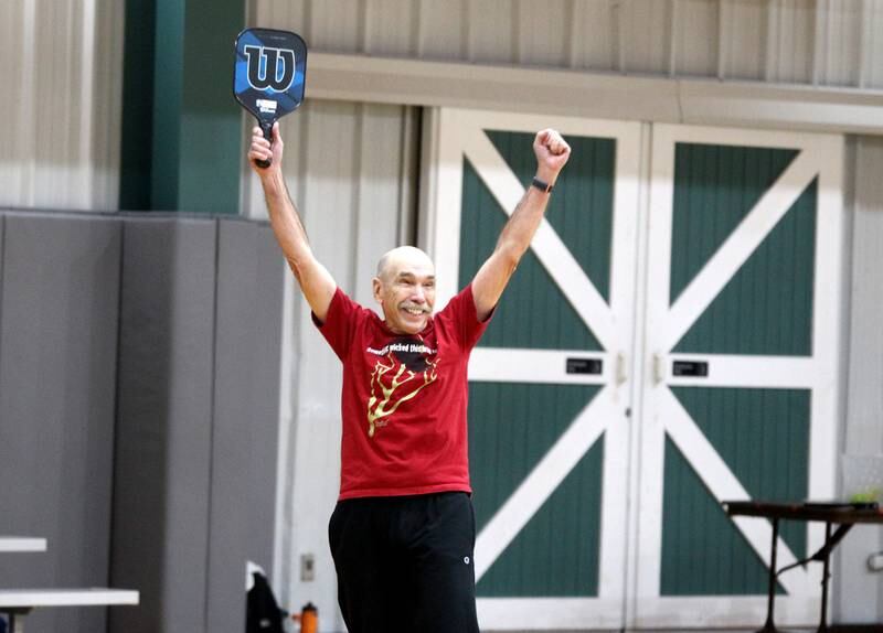 Carl Eberle of Geneva celebrates a point during a pickle ball open gym session at the Stephen D. Persinger Recreation Center in Geneva on Jan. 12, 2023.