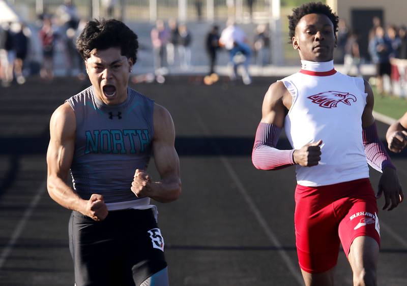 Woodstock North's Adan Castaneda celebrates winning the 100 meter dash over North Chicago’s Marlin Jeffries Jr. during the IHSA Class 2A Richmond-Burton Sectional Boys Track and Field Meet on Wednesday, May 20, 2026, at Richmond-Burton High School.