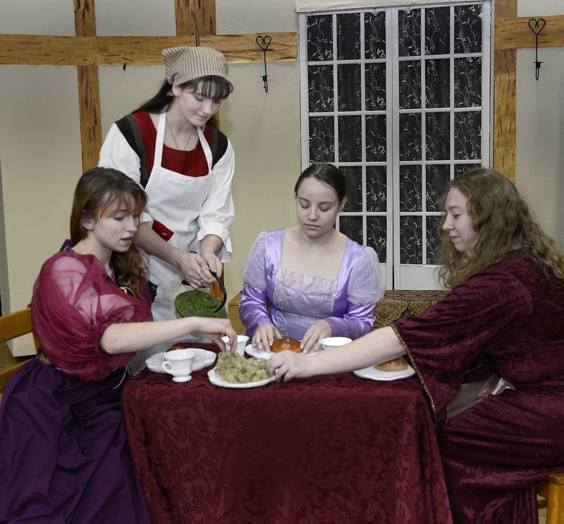 (Left to right) Eugenia Craig as Joy, Ella Biggin as Cinderella, Katie Hardin as Stepmother and Sara Duchon as Portia rehearse a scene from "Cinderella" they will perform Friday, March 31, and Saturday, April 1, at Marquette Academy in Ottawa.