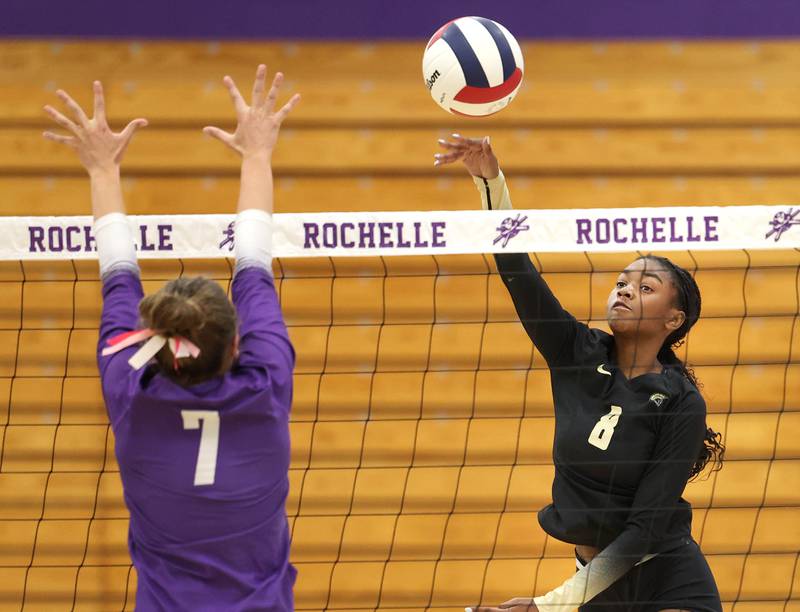 Sycamore's Khiara Thomas hits the ball by Rochelle's Meredith Bruns Tuesday, Oct. 28, 2025, during their Class 3A regional semifinal match at Rochelle High School.