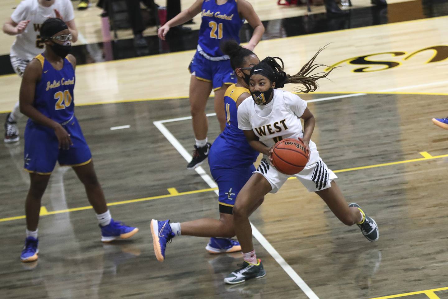 Joliet West's Lisa Thompson spins to the hoop on Tuesday, Feb. 16, 2021, at Joliet West High School in Joliet, Ill. The Tigers defeated the Steelmen 49-36.