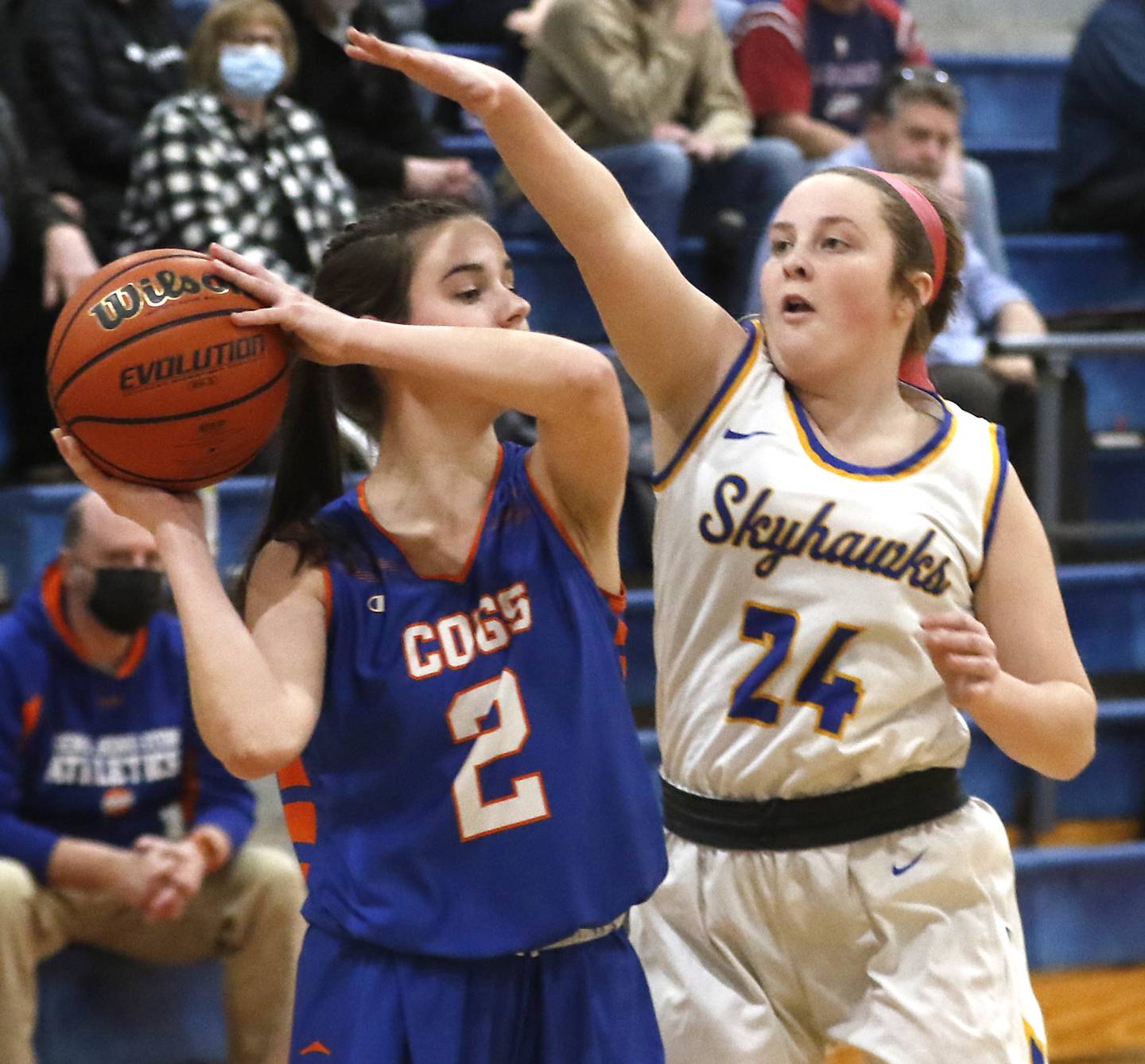 Johnsburg's Mackenzie McQuistion, right, applies defensive pressure to Genoa-Kingston's Emily Gilbert during a IHSA Class 2A Regional semifinal basketball game Monday evening, Feb. 14, 2022, between Johnsburg and Genoa-Kingston at Marian Central High School.