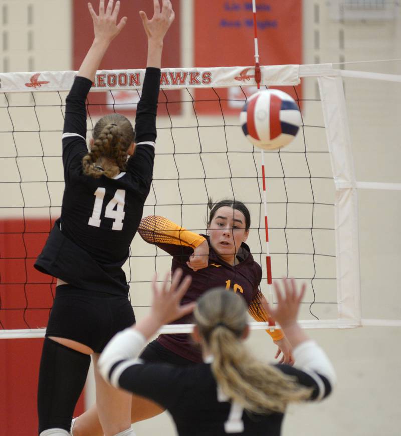 Stockton's Ireland Mensendike (16) drives a spike past Dixon's Leah Carlson (14) during the championship match at the Oregon Varsity Girls Volleyball Tournament on Saturday, Sept. 6, 2025 at the Blackhawk Center in Oregon.