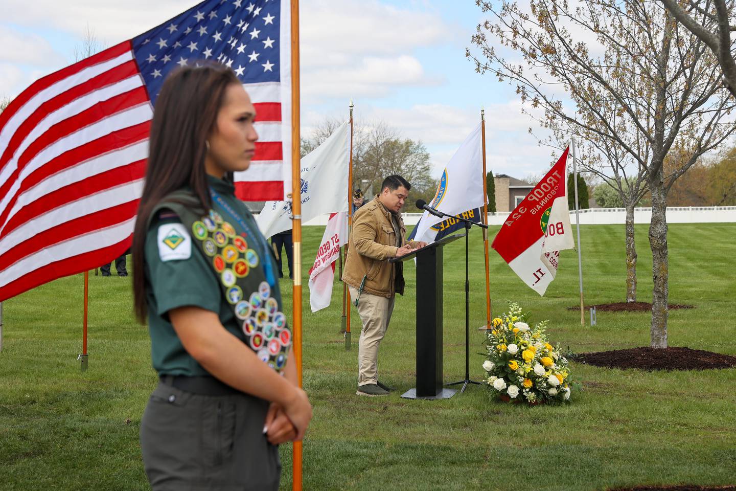 Eric Peterson, superintendent of the Veterans Assistance Commission of Kankakee County and the CEO of Project Headspace and Timing, speaks during the Gold Star Families Memorial Monument dedication ceremony at Marcotte Park in Bourbonnais on Saturday, April 26, 2025. The project was planned and fundraised for by 17-year-old Alexis McCullough, left, of Bourbonnais, for her Eagle Scout project in honor of her father, Col. Mark McCullough.
