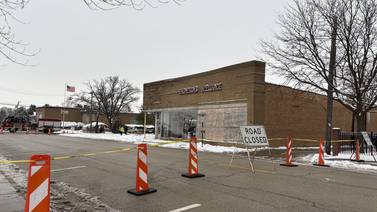 Roof of downtown Woodstock business collapses, road shut down amid concerns of further damage