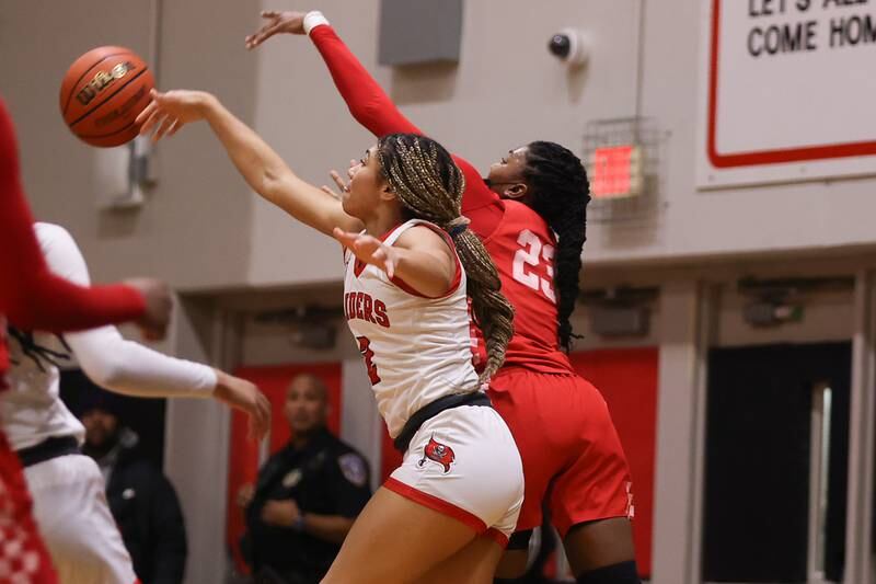 Bolingbrook’s Tatiana Thomas swats a pass away against Homewood-Flossmoor in the Class 4A Bolingbrook Sectional championship. Thursday, Feb. 24, 2022, in Bolingbrook.