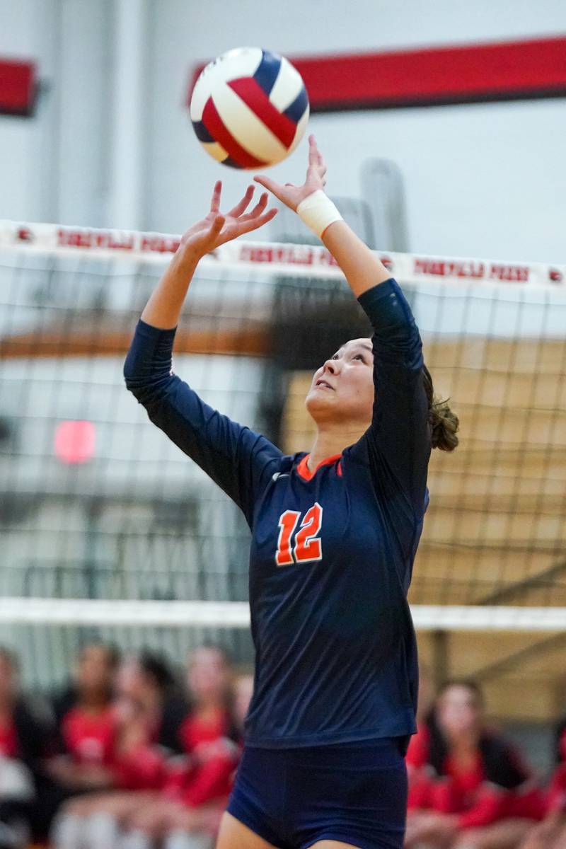 Oswego’s Ava Flanigan (12) sets the ball during the Class 4A Yorkville Regional final against Yorkville at Yorkville High School on Thursday, Oct. 31, 2024.