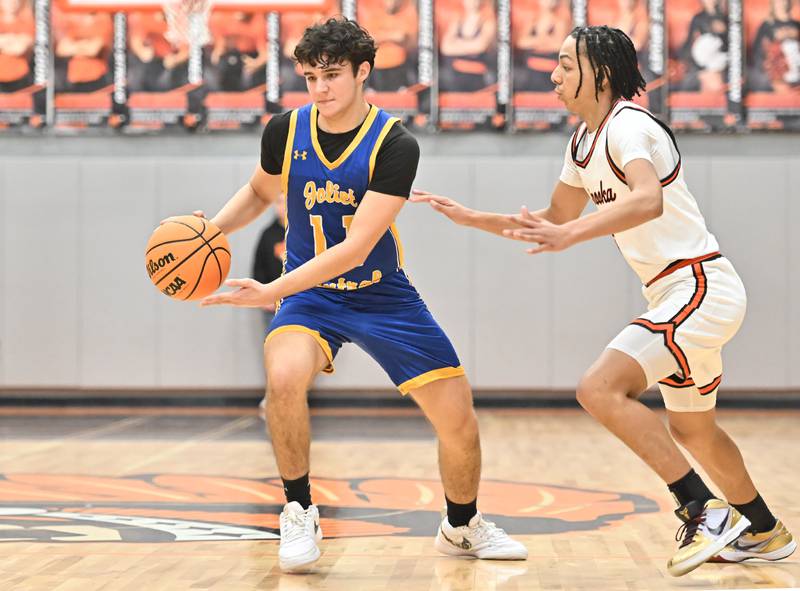 Joliet Central's Thomas Jemilo (11) in action during a conference game against Minooka on Friday, Jan. 10, 2025, at Minooka.