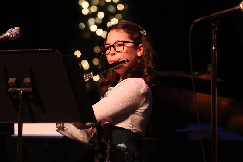 A flute player performs for the preshow entertainment at the A Very Rialto Christmas show on Monday, November 21st in Joliet.