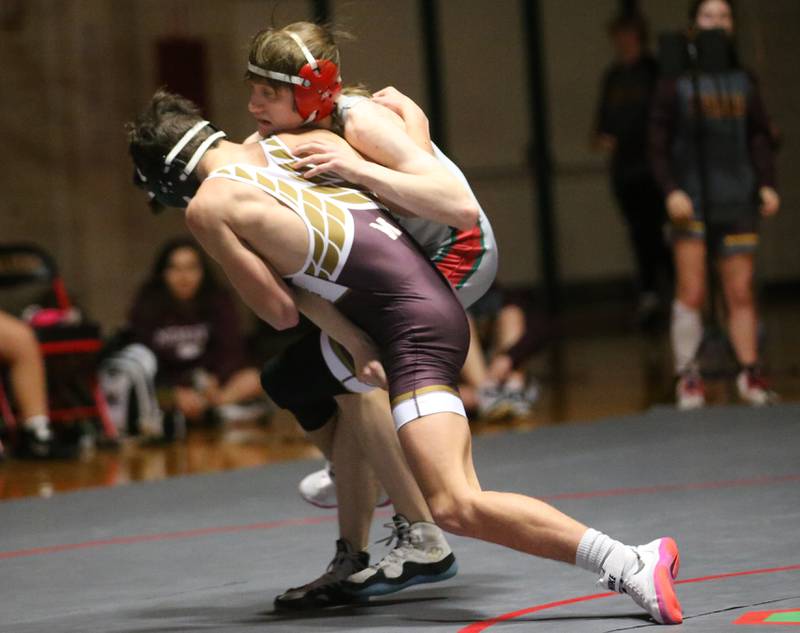 Morris's Carter Skoff takes down L-P's Zach Znaniecki on Thursday, Jan. 11 2024 in  Sellett Gymnasium.