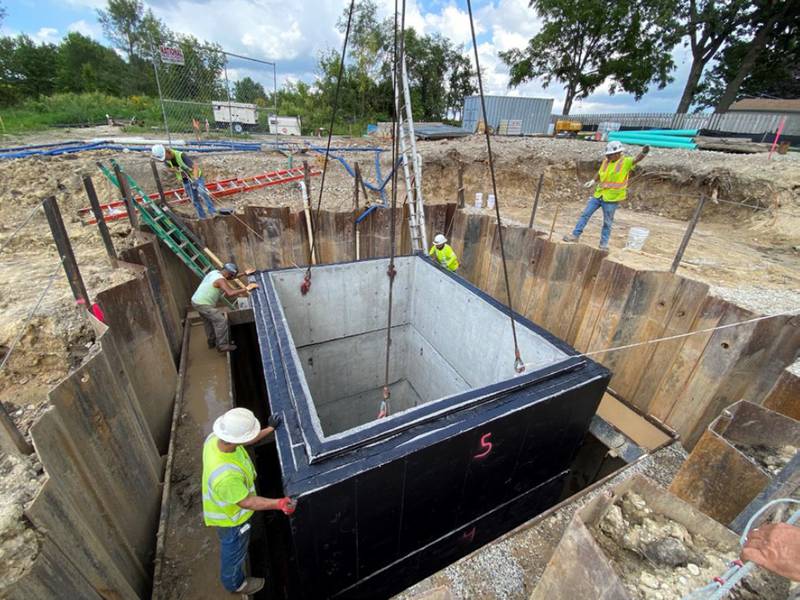 Crews place structures in September 2022 as part of Holiday Hills' sewer project, connecting the village to the Northern Moraine Water Reclamation District.