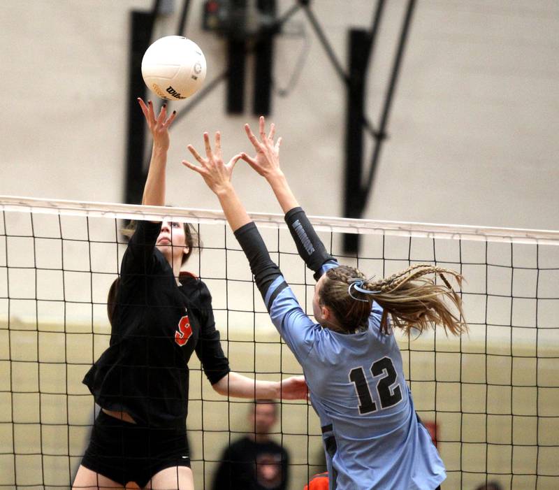 St. Charles East’s Natalee Rush (9) gets the ball over the net during a Class 4A Proviso West Sectional final against Willowbrook on Wednesday, Nov. 2, 2022.