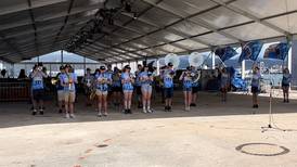 Johnsburg marching band play in Pearl Harbor parade, tribute