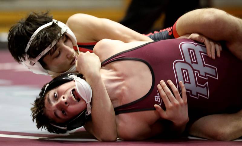 Huntley’s Cam Abordo pins Prairie Ridge’s Lorenzo Massart during the 132-pound match of a Fox Valley Conference boys wrestling meet on Thursday, Jan. 22, 2026, at Prairie Ridge High School Crystal Lake.