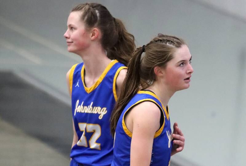 Johnsburg’s Skye Toussaint, left, and Summer Toussaint cross paths in varsity girls basketball on Saturday, Jan. 4, 2025, at McHenry High School in McHenry.