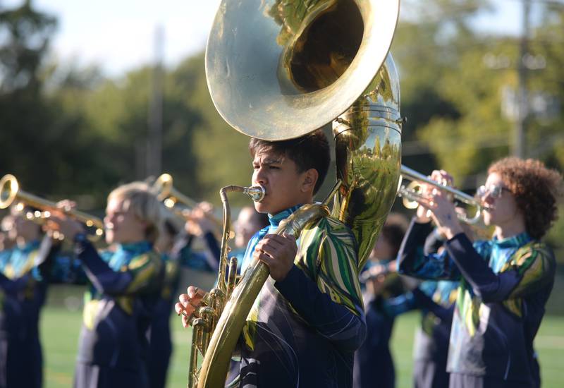 Oak Park/River Forest High School Marching Band members practice prior to participating in the annual Music Bowl Competition held at Downers Grove South Saturday, Oct. 7, 2023.