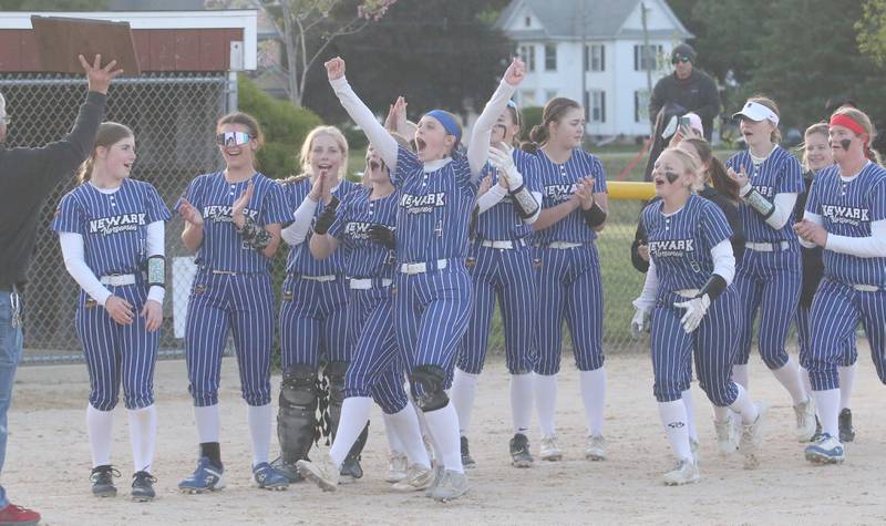Members of the Newark softball team gather to accept the Class 1A Regional plaque after defeating Earlville in the Class 1A Regional final on Thursday, May 22, 2025 at Indian Creek High School in Shabbona.