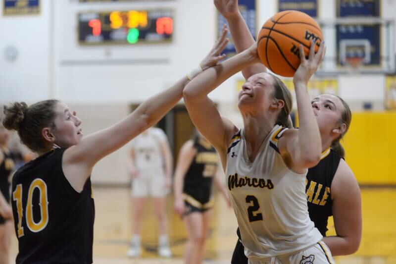 Polo's Laynie Mandrell (2) shoots as Riverdale's Molly Skahill (10) and Brooklyn Peterson (34) defend on Saturday, Jan. 18, 2025 at Polo High School.