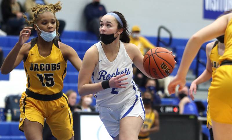 Burlington Central’s Rebecca Carani, right, navigates past Jacobs’ Janaya Banks during girls varsity basketball at Burlington Tuesday night.