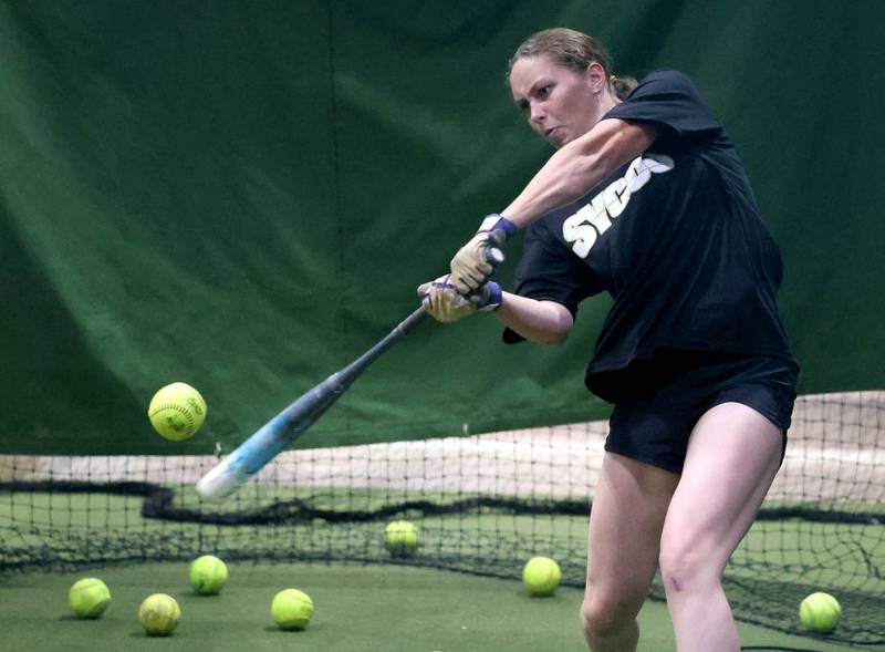 Sycamore Sycos 16u softball player Kendall Green works on hitting the ball to the opposite field Wednesday, June 18, 2025, at their indoor practice facility in DeKalb.